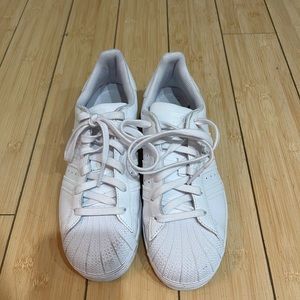 All white adidas superstar sneakers